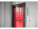 Condo unit entrance with a red door and security features at 7700 Porcher Dr. # 4202, Myrtle Beach, SC 29572
