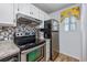 Stainless steel appliances and granite countertops are featured in this kitchen at 7700 Porcher Dr. # 4202, Myrtle Beach, SC 29572