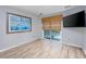 Living room with sliding door, hardwood floor, and large art piece at 7700 Porcher Dr. # 4202, Myrtle Beach, SC 29572