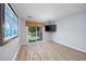 Bright living room with sliding glass doors leading to balcony at 7700 Porcher Dr. # 4202, Myrtle Beach, SC 29572