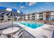 Inviting pool area with tables and umbrellas at 7700 Porcher Dr. # 4202, Myrtle Beach, SC 29572