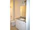 Bathroom with granite countertop, white cabinets and a tub at 81 Delray Dr. # 2-C, Murrells Inlet, SC 29576