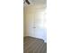 Bedroom with double door closet and wood-look floors at 81 Delray Dr. # 2-C, Murrells Inlet, SC 29576
