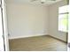 Bright bedroom with large window and wood-look floors at 81 Delray Dr. # 2-C, Murrells Inlet, SC 29576