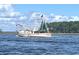 White and red fishing boat on the water at 81 Delray Dr. # 2-C, Murrells Inlet, SC 29576