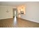 Open concept dining area and kitchen with hardwood floors and a chandelier at 81 Delray Dr. # 2-C, Murrells Inlet, SC 29576