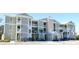 Two-story building with light green siding, white trim, and balconies at 81 Delray Dr. # 2-C, Murrells Inlet, SC 29576