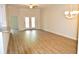 Spacious living room with hardwood floors and access to a balcony at 81 Delray Dr. # 2-C, Murrells Inlet, SC 29576