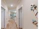 Light and bright hallway with hardwood floors and coastal decor at 81 Delray Dr. # 3-B, Murrells Inlet, SC 29576