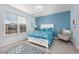 Bright bedroom with a queen bed, window blinds, and a cozy armchair at 840 San Marco Ct. # D, Myrtle Beach, SC 29579