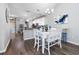 Bright dining room with white table and chairs, adjacent to kitchen at 840 San Marco Ct. # D, Myrtle Beach, SC 29579