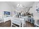 White table and chairs in dining area with view into kitchen at 840 San Marco Ct. # D, Myrtle Beach, SC 29579