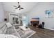 Living room with gray sectional sofa, flat-screen TV, and wood floors at 840 San Marco Ct. # D, Myrtle Beach, SC 29579