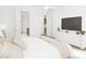 Bright bedroom with ensuite bathroom access and a large TV at 894 Foxtail Dr. # D-41, Longs, SC 29568
