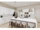Modern kitchen with white cabinets and a large center island at 894 Foxtail Dr. # D-41, Longs, SC 29568