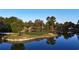 Golf course community with houses, trees, and a lake at 898 Foxtail Dr. # D-42, Longs, SC 29568