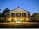 Community clubhouse at night, offering classic architecture and welcoming lighting at 898 Foxtail Dr. # D-42, Longs, SC 29568