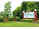 The Long Bay Club entrance with lush landscaping and brickwork at 898 Foxtail Dr. # D-42, Longs, SC 29568
