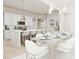 Open concept dining area with a large table and white chairs at 898 Foxtail Dr. # D-42, Longs, SC 29568