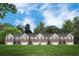Front view of townhouses with brick facade and landscaped lawn at 898 Foxtail Dr. # D-42, Longs, SC 29568
