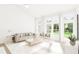 Sunlit living room with comfy seating and large windows at 898 Foxtail Dr. # D-42, Longs, SC 29568