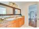 Bathroom featuring double sinks, granite counters and wood cabinetry at 899 Kinlaw Ln., Conway, SC 29527