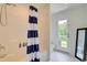 Bright bathroom features a blue and white striped shower curtain and a white door leading to a private balcony at 899 Kinlaw Ln., Conway, SC 29527