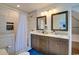 Bathroom featuring dual sinks, a walk-in shower, and modern finishes at 899 Kinlaw Ln., Conway, SC 29527