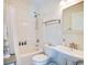 Bright bathroom with white fixtures, a shower-tub combo, and a pedestal sink at 899 Kinlaw Ln., Conway, SC 29527