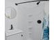 Modern bathroom featuring a sleek vanity, round mirror, and a tiled shower at 899 Kinlaw Ln., Conway, SC 29527