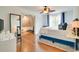 Bedroom featuring hardwood floors, a comfortable bed, and an ensuite bathroom at 899 Kinlaw Ln., Conway, SC 29527