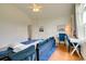 Large bedroom with couch, desk, and windows letting in lots of bright, natural light at 899 Kinlaw Ln., Conway, SC 29527