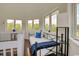 Bright bonus room features a single daybed and multiple windows at 899 Kinlaw Ln., Conway, SC 29527
