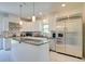 Spacious kitchen boasts an island, stainless steel appliances, granite countertops, and custom white cabinets at 899 Kinlaw Ln., Conway, SC 29527