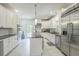 Modern kitchen with white cabinets, stainless steel appliances, and granite countertops at 899 Kinlaw Ln., Conway, SC 29527