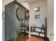 Modern laundry room with stacked washer and dryer, shelving, and stylish decor at 899 Kinlaw Ln., Conway, SC 29527
