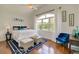 Charming primary bedroom features a decorative rug, bright window, and tasteful decor, creating a relaxing atmosphere at 899 Kinlaw Ln., Conway, SC 29527
