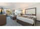 Two beds, balcony view, and a dresser at 1105 S Ocean Blvd. # 252, Myrtle Beach, SC 29577