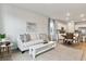 Living Room with light colored sofa and large windows at 1125 Blueback Herring Way # 09, Conway, SC 29526