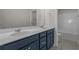 Bathroom featuring a dual-sink vanity, quartz countertop, and access to the tub and shower area at 1212 Nw Calabash Station Blvd., Calabash, NC 28467