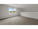 Bedroom with large window and neutral carpet, offering a bright and comfortable space at 1212 Nw Calabash Station Blvd., Calabash, NC 28467