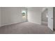 Bedroom with neutral carpet and single window, and ensuite access, offering a comfortable space at 1212 Nw Calabash Station Blvd., Calabash, NC 28467