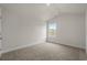 Bedroom featuring neutral carpet and a single window, offering a private and comfortable space at 1212 Nw Calabash Station Blvd., Calabash, NC 28467