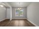 Spacious dining room with hardwood floors, large windows, and natural light at 1212 Nw Calabash Station Blvd., Calabash, NC 28467