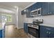 Kitchen featuring navy cabinets, quartz countertops, and stainless appliances at 1212 Nw Calabash Station Blvd., Calabash, NC 28467