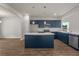 Kitchen featuring navy cabinets, quartz countertops, an island, and stainless appliances at 1212 Nw Calabash Station Blvd., Calabash, NC 28467