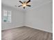 Bedroom featuring a ceiling fan, window, and laminate wood flooring at 1357 Jolly Roger Dr., North Myrtle Beach, SC 29582