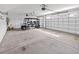 Spacious garage with a golf cart, white walls, and ample lighting provides secure parking at 1357 Jolly Roger Dr., North Myrtle Beach, SC 29582