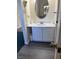 Bathroom with white vanity and oval mirror at 1650 Deer Creek Rd., Surfside Beach, SC 29575