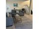 Living room with gray sectional sofa and a coffee table at 1650 Deer Creek Rd., Surfside Beach, SC 29575